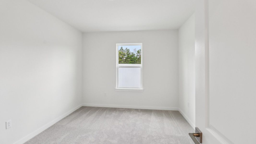 Guest Bed in the Monterey End Townhome by DRB Homes - Cyrene at Harmony in St Cloud FL