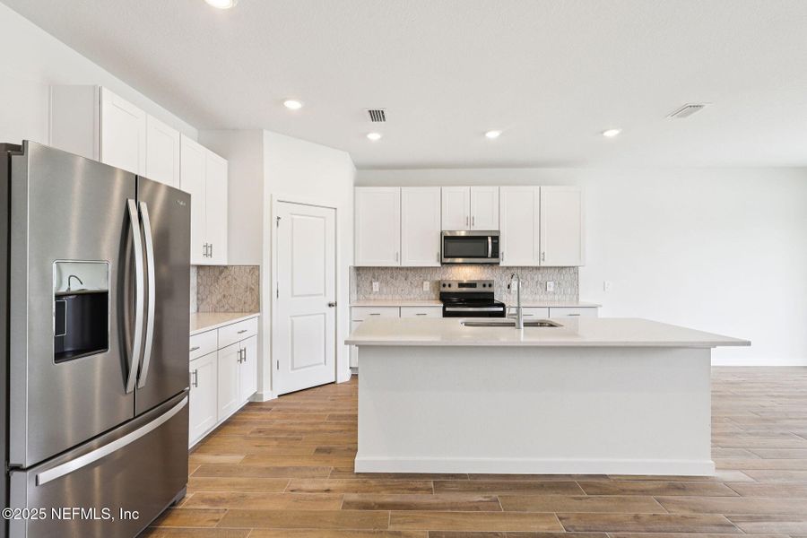 Furnished interior view inside a new home in Lakes at Bella Lago - Signature Series, Green Cove Springs (Image 4).