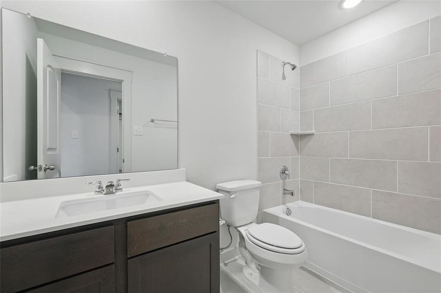 Full bath featuring vanity and bathtub / shower combination Full bath featuring vanity and bathtub / shower combination