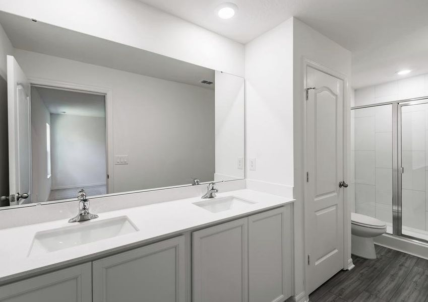 The master bathroom has a spacious vanity, making it easy to get ready in the mornings