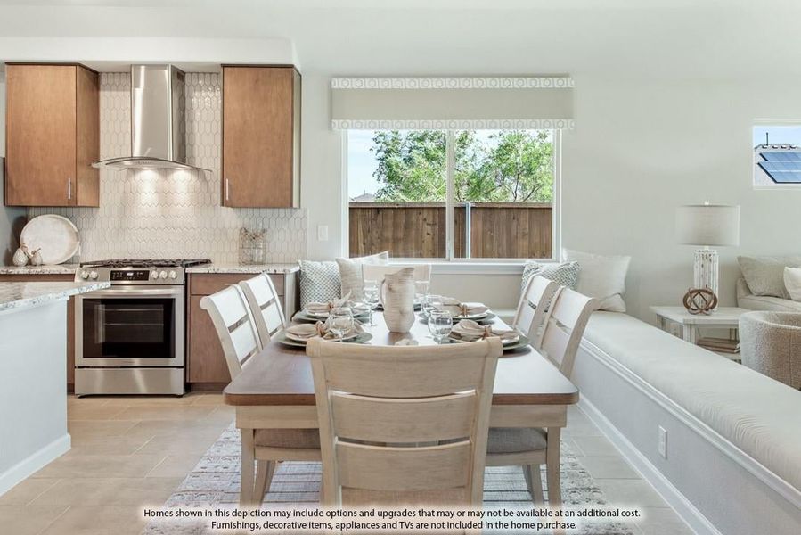 Open kitchen and dining area with wood cabinets, stainless steel range, and built-in bench seating at a set dining table.