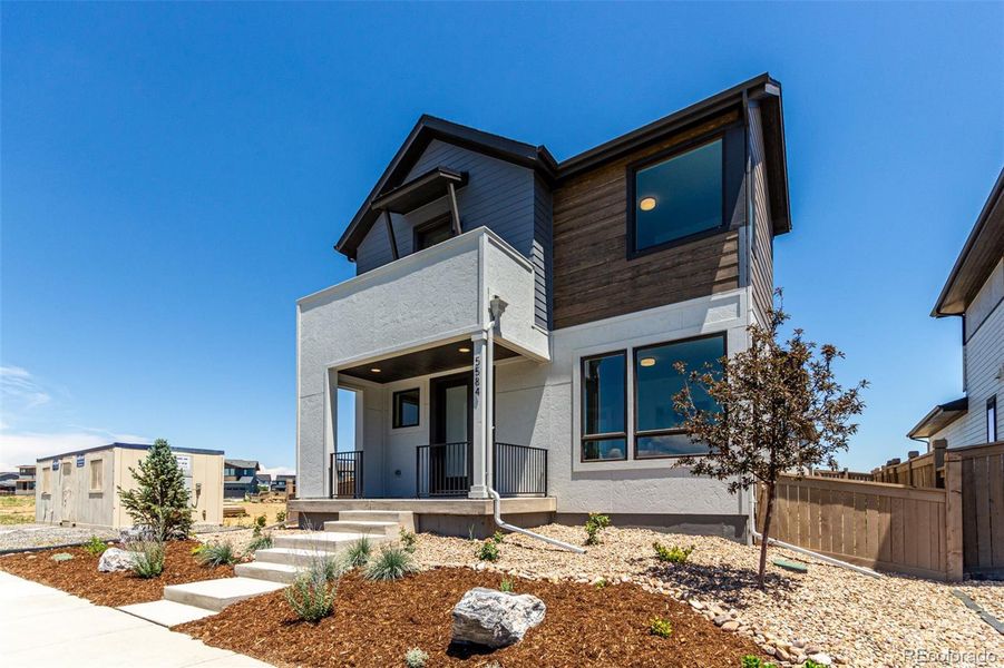 Front exterior of a new home in West Grange, Longmont, CO, highlighting curb appeal (Image 1).