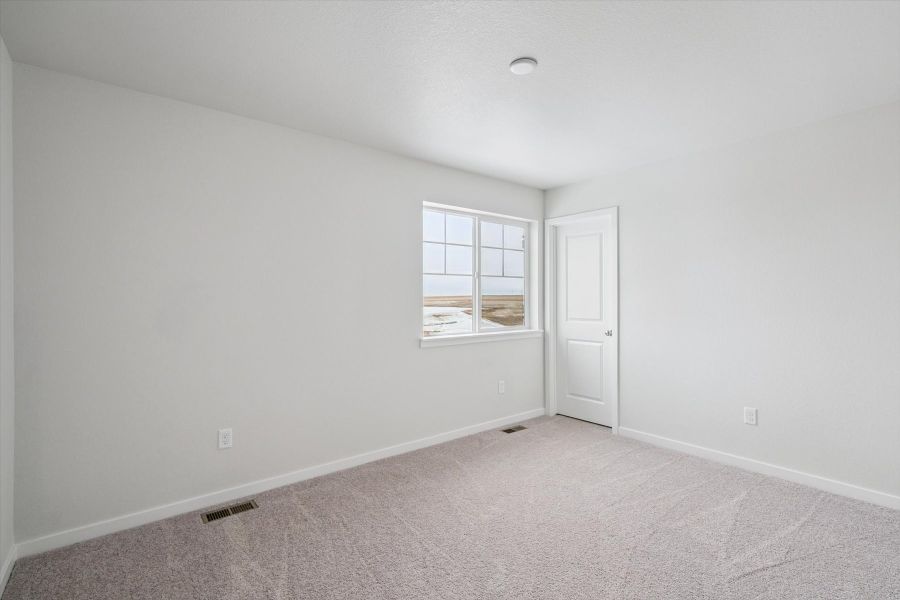 A room with a window and a door. A room with a window and a door.