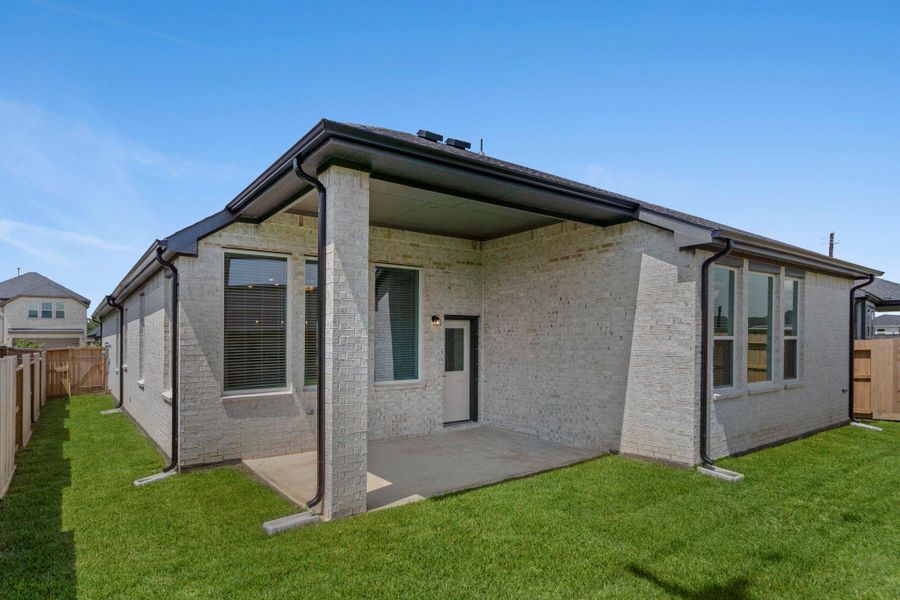 Front exterior of a new home in Mulberry Farms, Santa Fe, TX, highlighting curb appeal (Image 12).
