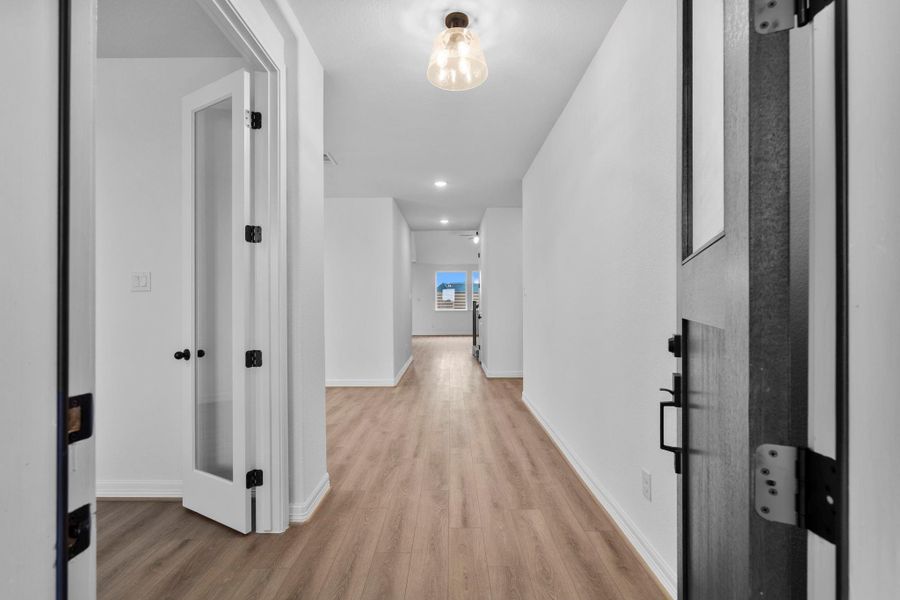 The foyer sets the tone with repurposed style, welcoming guests with warmth and urban sophistication. The foyer sets the tone with repurposed style, welcoming guests with warmth and urban sophistication.