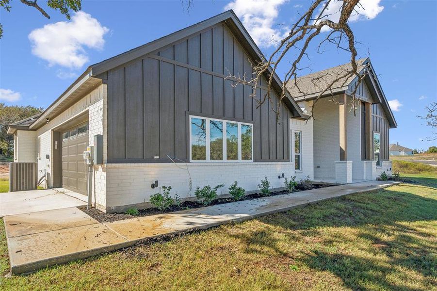 Front exterior of a new home in Lucky Ridge, Boyd, TX, highlighting curb appeal (Image 21). Front exterior of a new home in Lucky Ridge, Boyd, TX, highlighting curb appeal (Image 21).