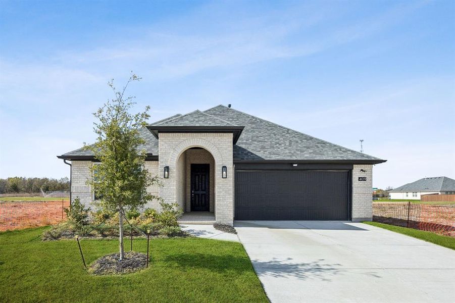 Front exterior of a new home in Santorini, Seagoville, TX, highlighting curb appeal (Image 1).