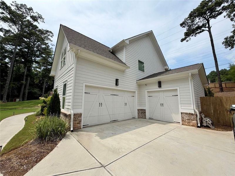 Front exterior of a new home in , Marietta, GA, highlighting curb appeal (Image 24).