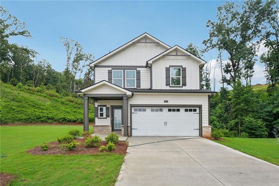 Front exterior of a new home in Hemingway - Reserve Series, Cumming, GA, highlighting curb appeal (Image 27). Front exterior of a new home in Hemingway - Reserve Series, Cumming, GA, highlighting curb appeal (Image 27).