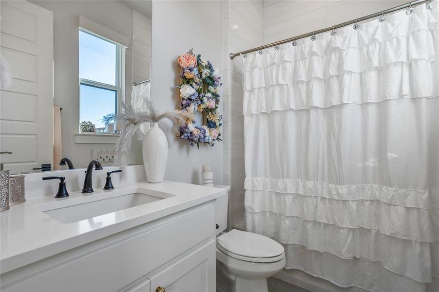 Ensuite bathroom offers privacy for guests or family