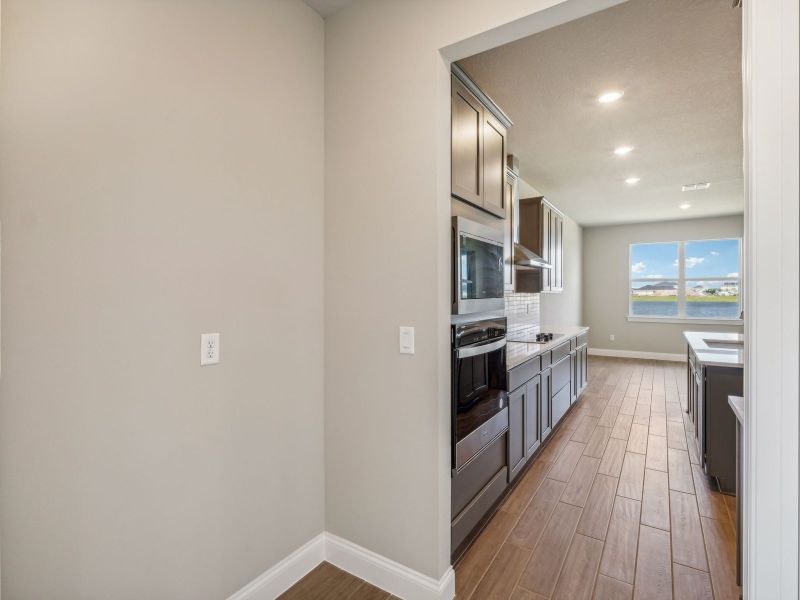 Kitchen in the Onyx floorplan at 6406 NW Sweetwood Drive