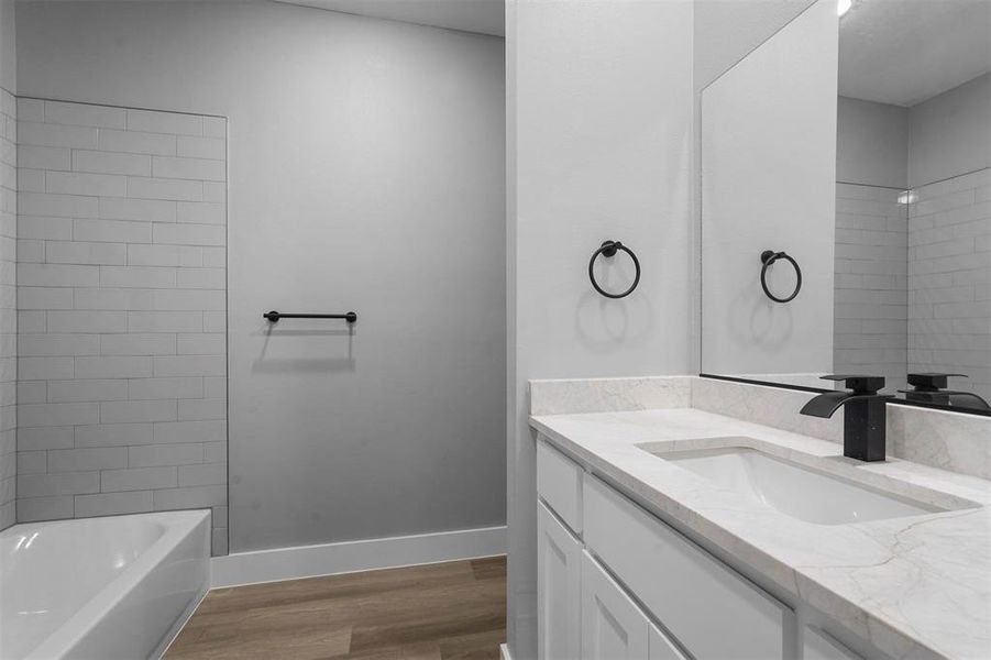 Bathroom featuring hardwood / wood-style floors and vanity