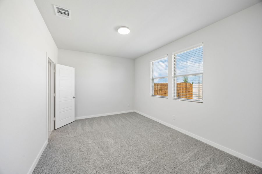 Primary Bedroom in the Birch home plan by Trophy Signature Homes – REPRESENTATIVE PHOTO