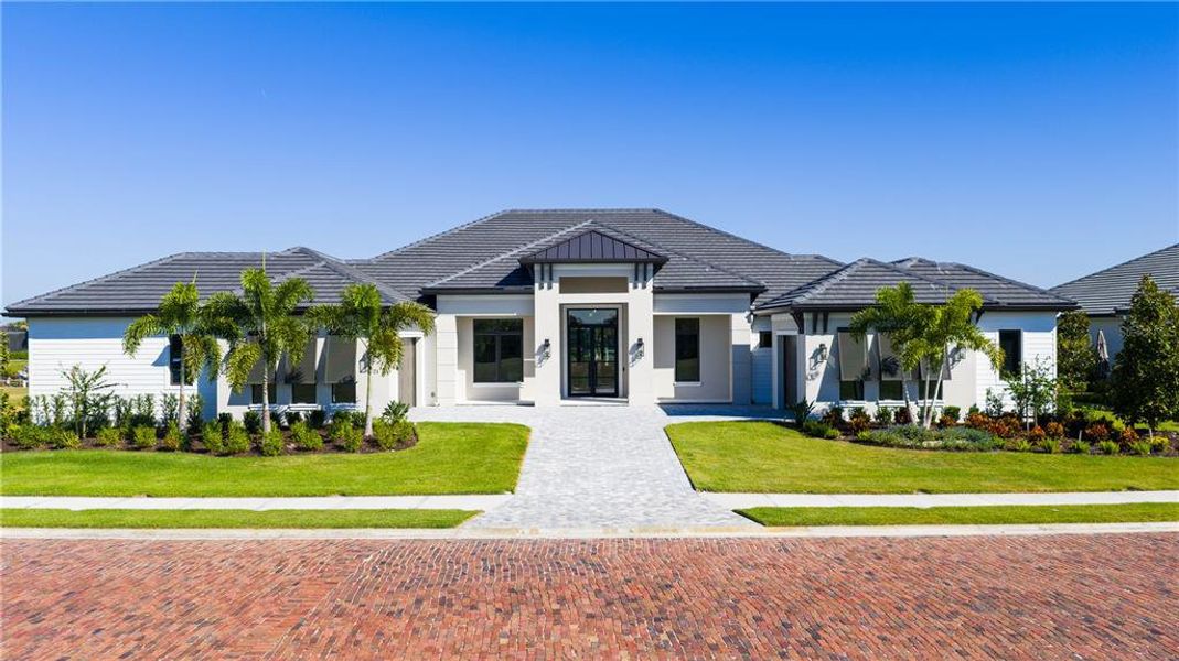 Front exterior of a new home in , Parrish, FL, highlighting curb appeal (Image 1). Front exterior of a new home in , Parrish, FL, highlighting curb appeal (Image 1).