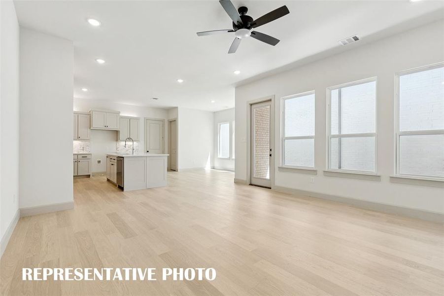 This light and bright open concept floor plan begs for the entertaining to begin!  REPRESENTATIVE PHOTO