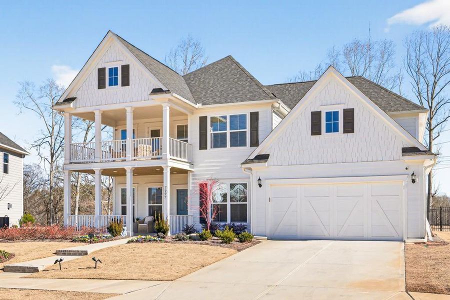 Front exterior of a new home in Reunion, Flowery Branch, GA, highlighting curb appeal (Image 26).