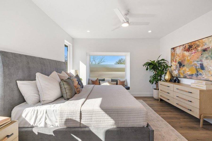 Bedroom with dark wood-style floors, a ceiling fan, and recessed lighting