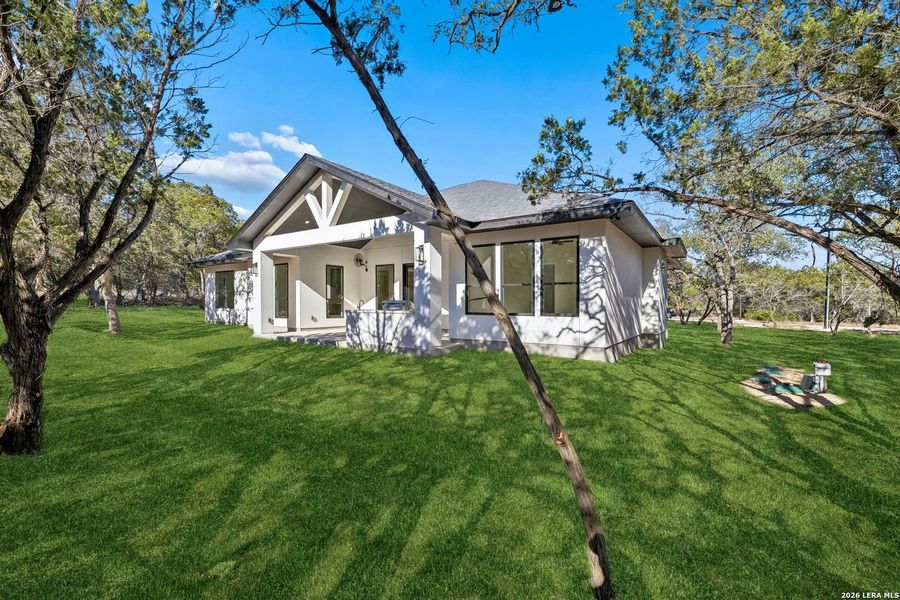 Exterior details and patio area of a home in , Spring Branch (Image 36).