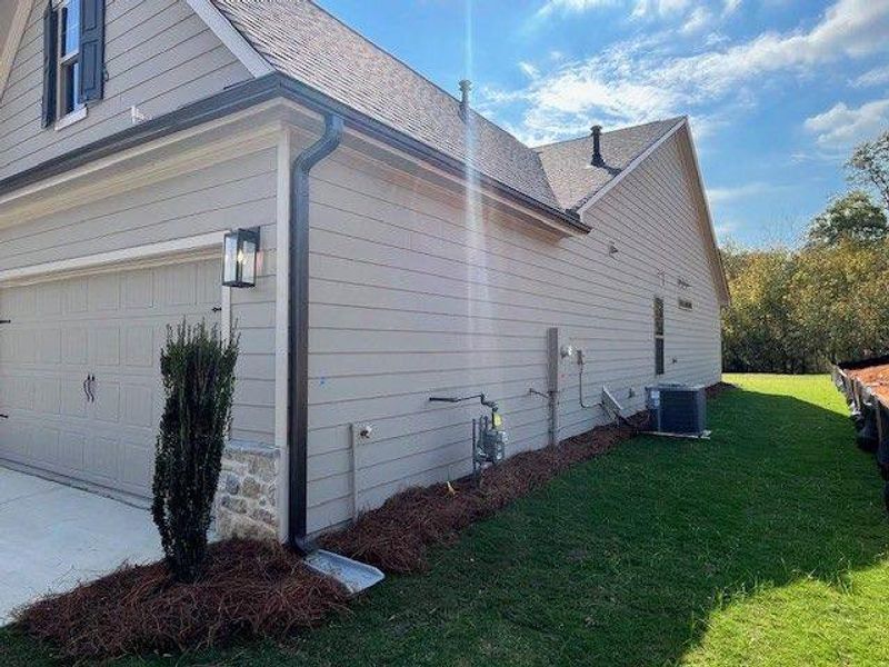 Exterior details and patio area of a home in Soleil Belmont Park, Canton (Image 7). Exterior details and patio area of a home in Soleil Belmont Park, Canton (Image 7).