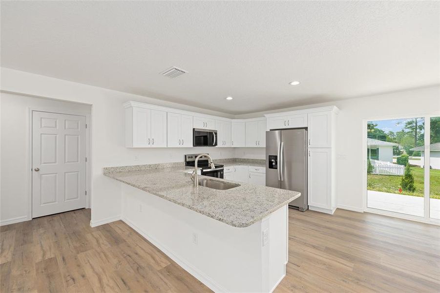 Furnished interior view inside a new home in , Dunnellon (Image 12).