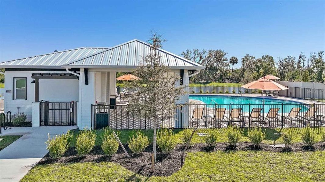 Front exterior of a new home in Mandarin Grove, Palmetto, FL, highlighting curb appeal (Image 15).