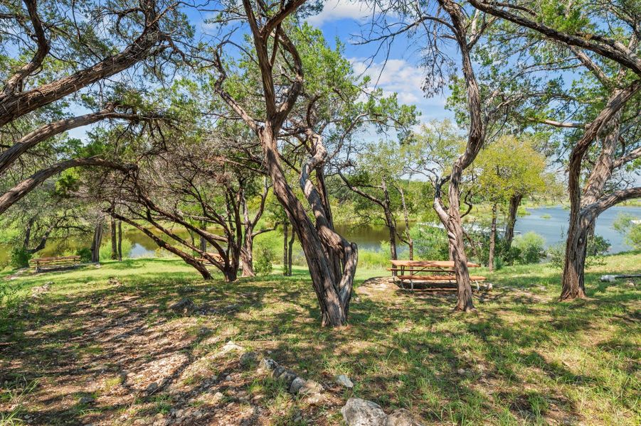 View of grassy yard featuring a water view View of grassy yard featuring a water view