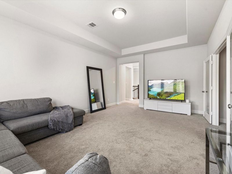 Game room is accessed from the top of the stairs and is connected to an equally large media room.