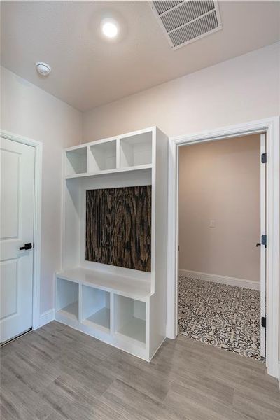 Mudroom featuring light wood-type flooring