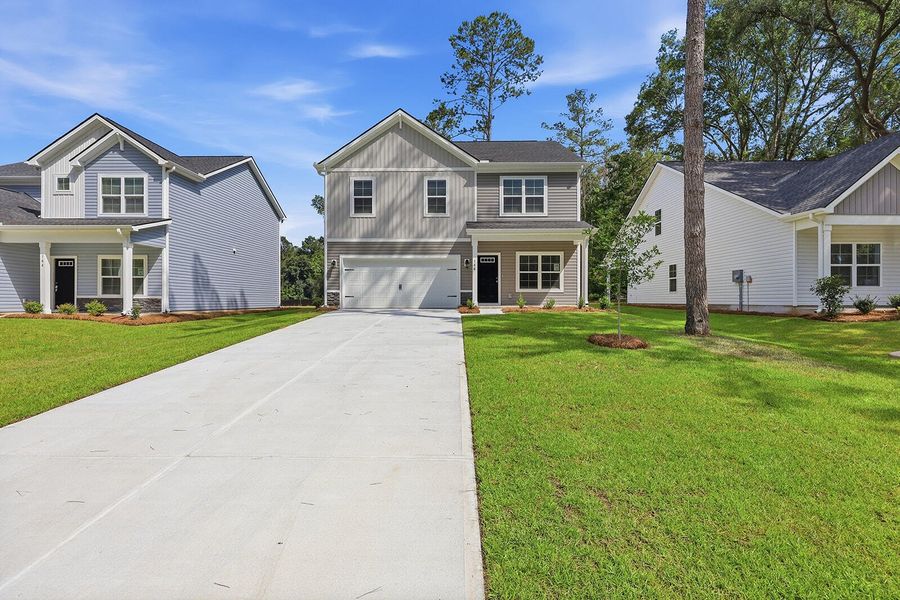 Front exterior of a new home in , Yemassee, SC, highlighting curb appeal (Image 1). Front exterior of a new home in , Yemassee, SC, highlighting curb appeal (Image 1).