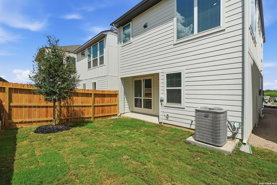 Exterior details and patio area of a home in Centero at Stone Oak, San Antonio (Image 4).