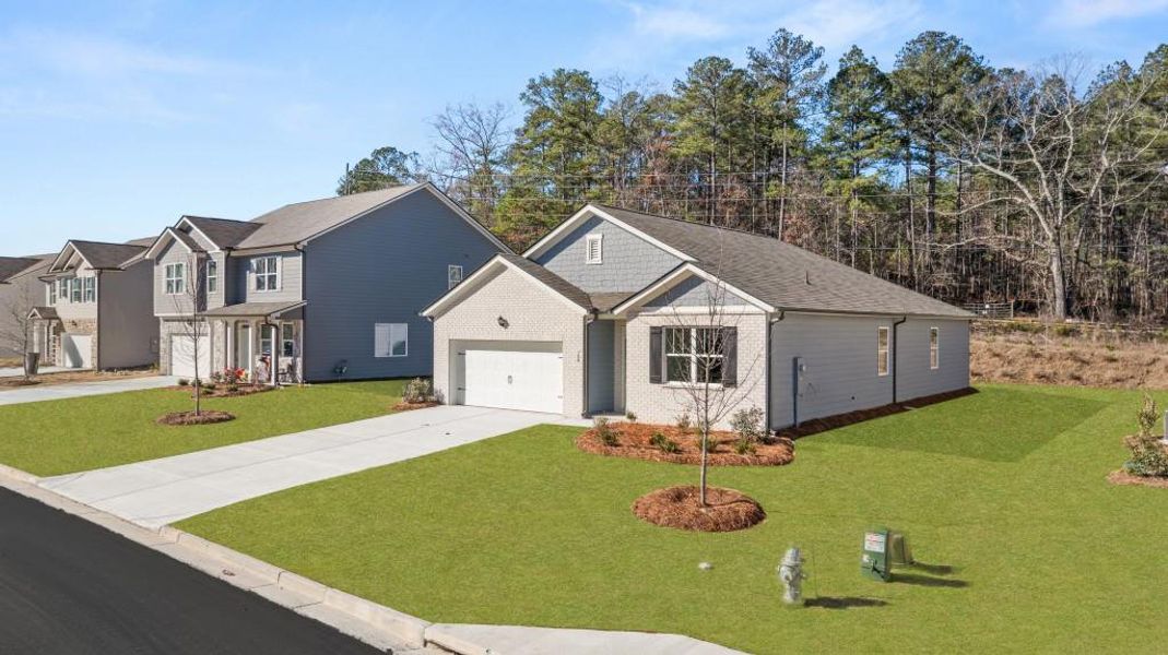 Front exterior of a new home in Northwoods at Mirror Lake, Villa Rica, GA, highlighting curb appeal (Image 20).