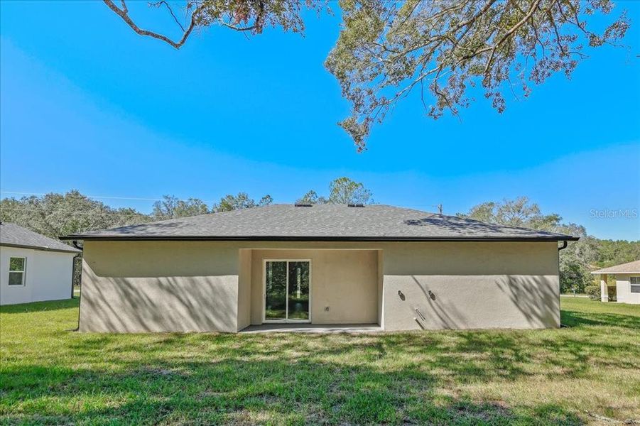 Exterior details and patio area of a home in , Citrus Springs (Image 3).