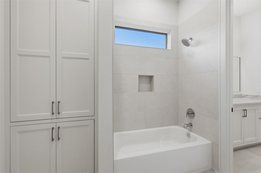 Secondary bedroom jack and Jill with custom cabinetry