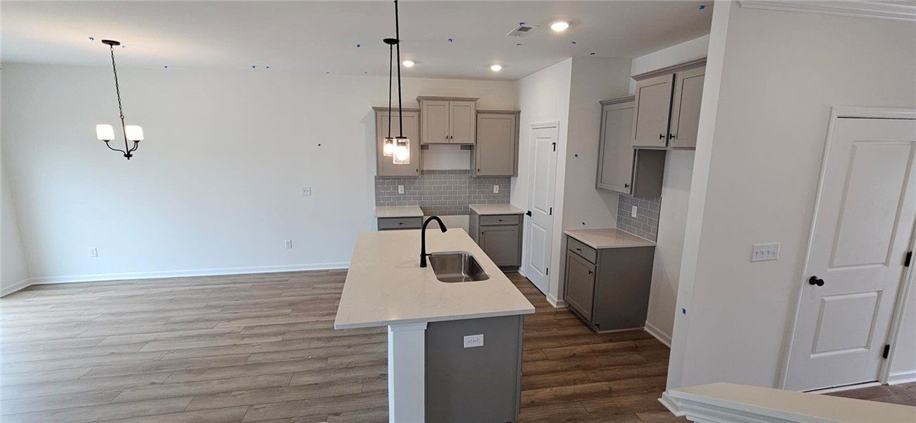 This newly constructed kitchen features a large is This newly constructed kitchen features a large is