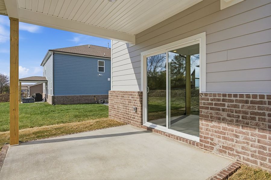 A house with a brick patio.