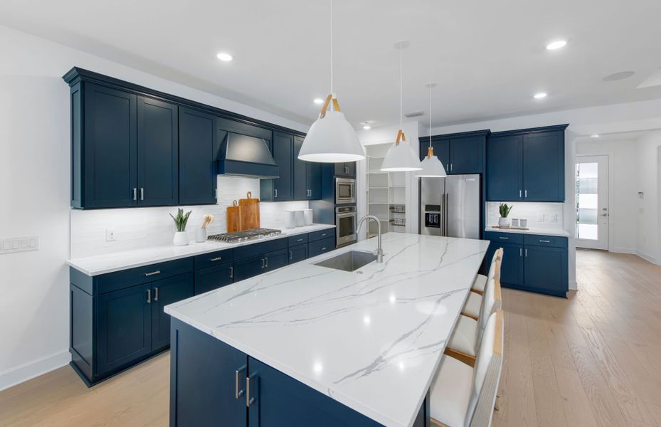 Kitchen with stainless steel appliances and large center island Kitchen with stainless steel appliances and large center island