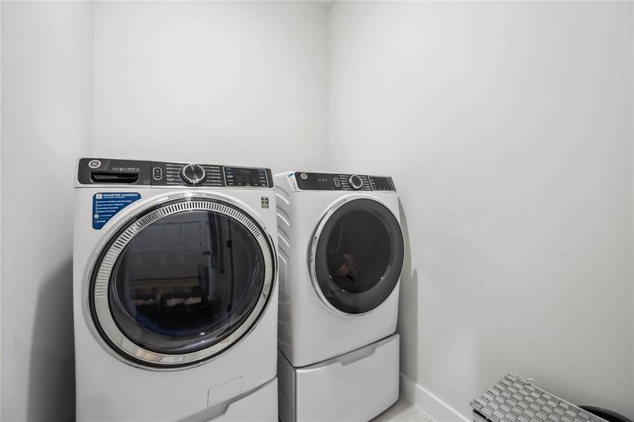 Laundry Room includes fantastic front-loading top of the line GE washer and dryer!