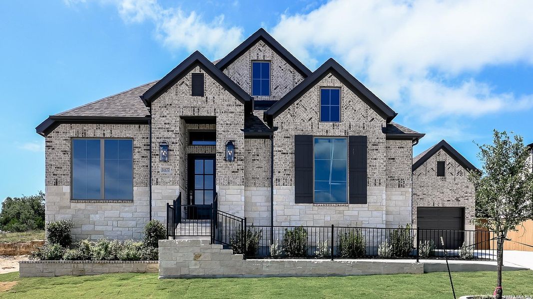 Front exterior of a new home in Johnson Ranch, Bulverde, TX, highlighting curb appeal (Image 2). Front exterior of a new home in Johnson Ranch, Bulverde, TX, highlighting curb appeal (Image 2).