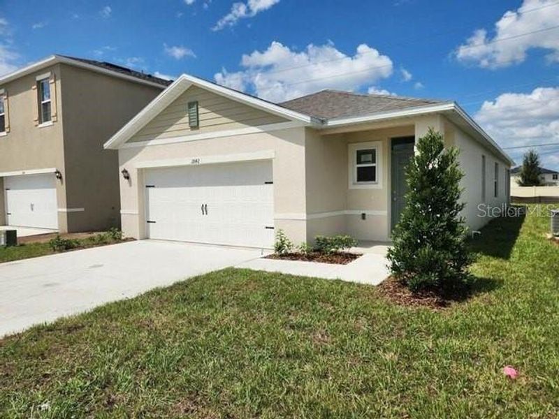 Front exterior of a new home in , Kissimmee, FL, highlighting curb appeal (Image 2). Front exterior of a new home in , Kissimmee, FL, highlighting curb appeal (Image 2).
