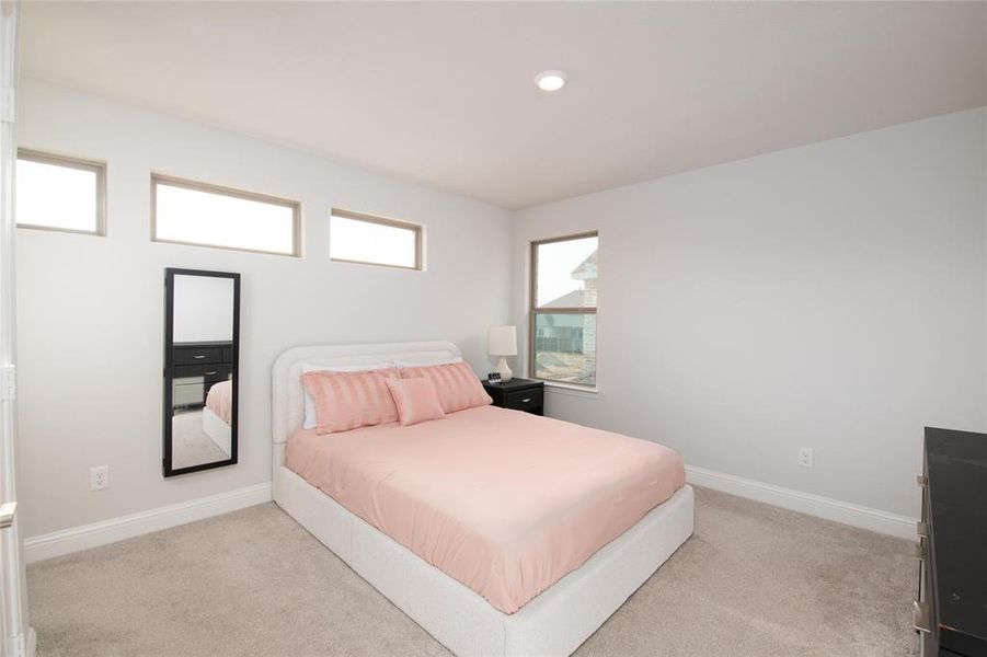 Perfect for guests, teens, or extended family, this spacious secondary bedroom enjoys the rare luxury of its own private ensuite bath, offering comfort, privacy, and convenience. Perfect for guests, teens, or extended family, this spacious secondary bedroom enjoys the rare luxury of its own private ensuite bath, offering comfort, privacy, and convenience.