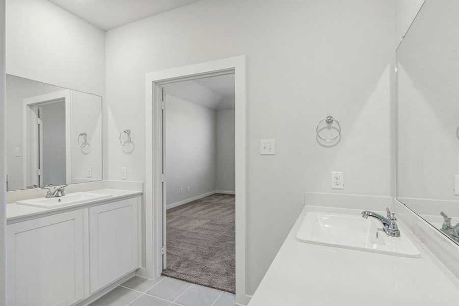 Primary Bathroom in the Willow home plan by Trophy Signature Homes – REPRESENTATIVE PHOTO
