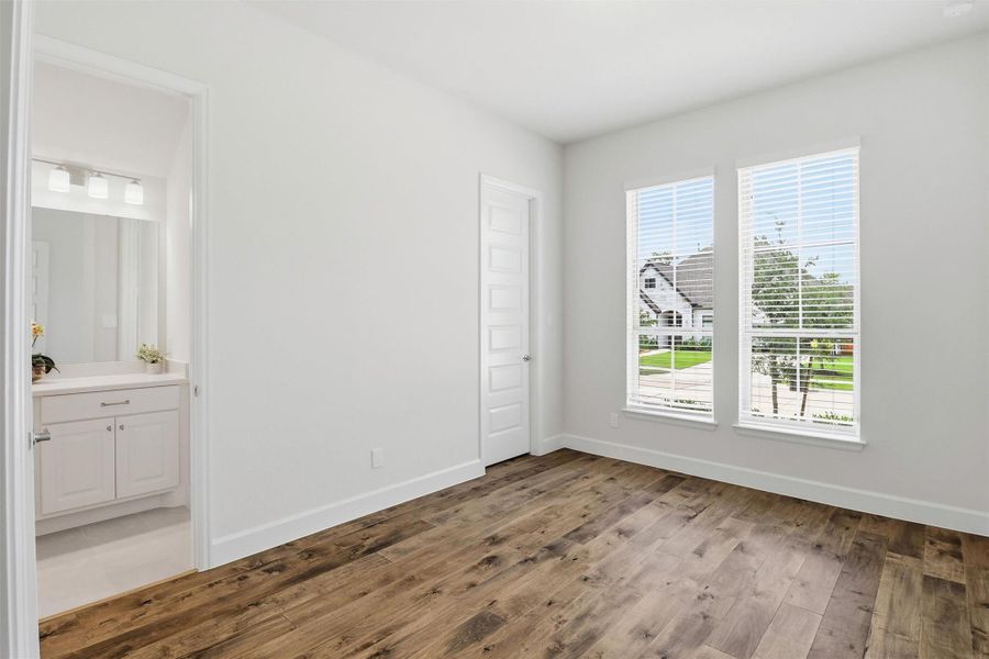 Opposite the home office you will find two nicely sized guest bedrooms. The bedrooms are adjoined with a shared bathroom.