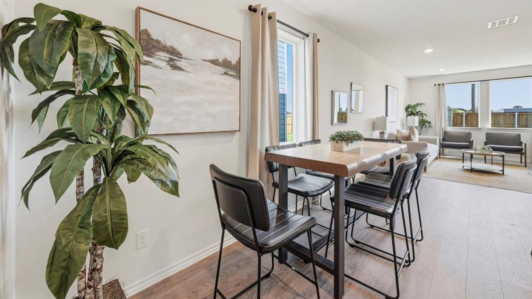 Dining room featuring light wood-style flooring and recessed lighting