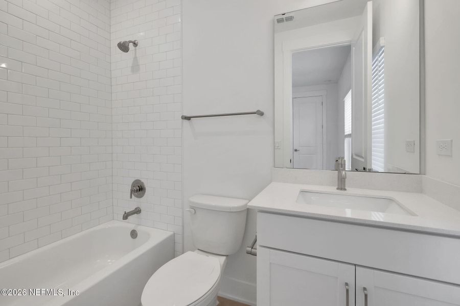 Furnished interior view inside a new home in North Beach Townhomes, Jacksonville Beach (Image 14).