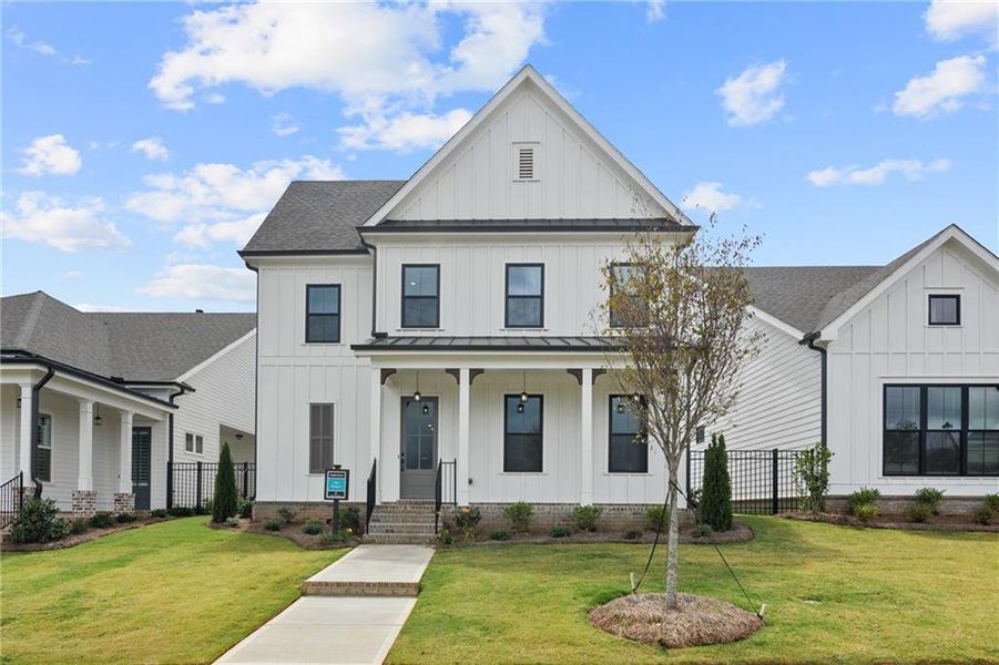 Front exterior of a new home in Promenade at Sawnee Village, Cumming, GA, highlighting curb appeal (Image 24).