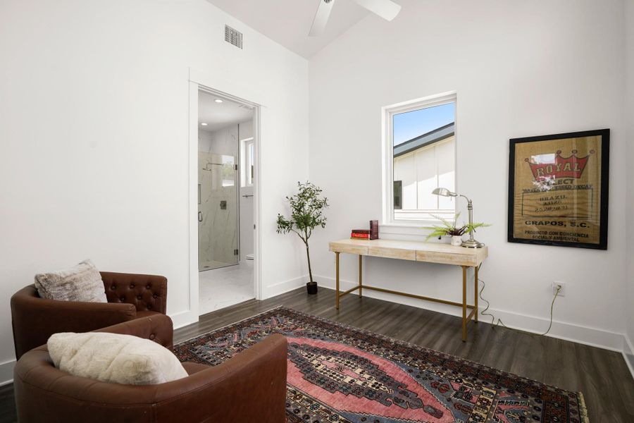Hardwood-style flooring extends through this versatile space, perfect for work or relaxation. Hardwood-style flooring extends through this versatile space, perfect for work or relaxation.