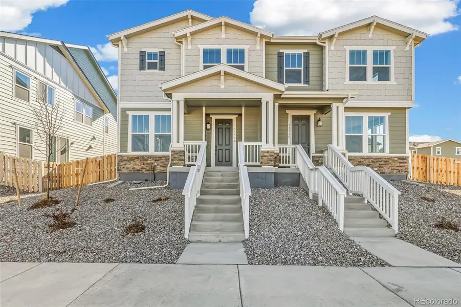 Front exterior of a new home in Turnberry, Commerce City, CO, highlighting curb appeal (Image 1).