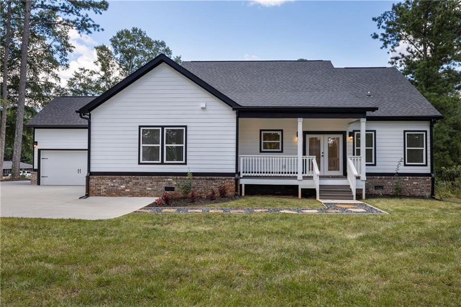 Front exterior of a new home in , Monroe, GA, highlighting curb appeal (Image 31). Front exterior of a new home in , Monroe, GA, highlighting curb appeal (Image 31).