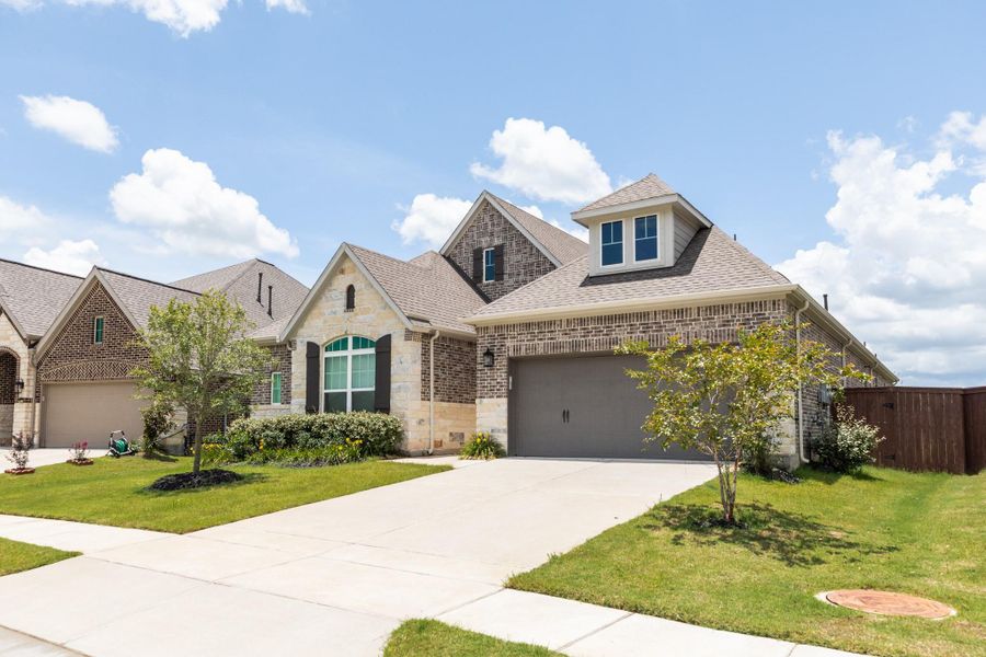 Another view of the front of the home with the double driveway.