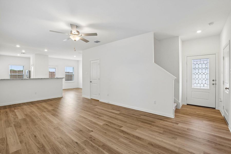 The living room is open to the kitchen and dining area creating the perfect seamless design. You’ll never miss a moment when you’re entertaining your friends and family members!